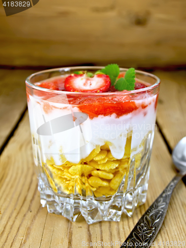 Image of Dessert milk with strawberry in glassful on board