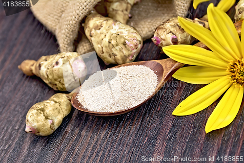 Image of Flour of Jerusalem artichoke in spoon with vegetable on board