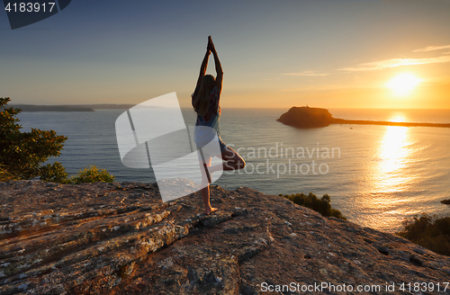 Image of Yoga by the Sea at sunrise - Tree Pose Vrksasana