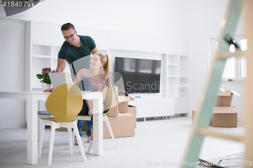 Image of Young couple moving in a new home