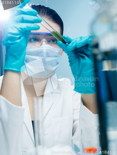 Image of Young scholar working with reagent