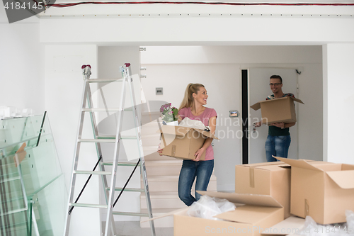 Image of young couple moving into a new home