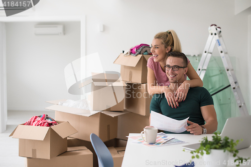 Image of Young couple moving in a new home