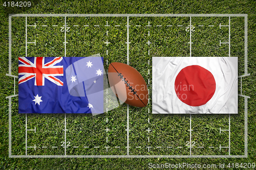 Image of Australia vs. Japan\r flags on rugby field