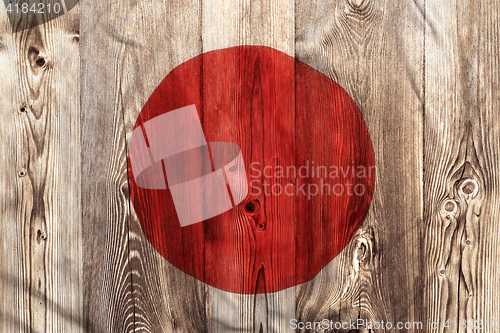 Image of National flag of Japan, wooden background