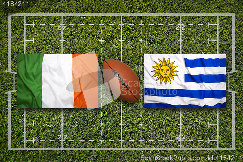 Image of Ireland vs. Uruguay flags on rugby field