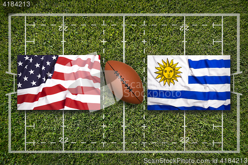 Image of USA vs. Uruguay flags on rugby field