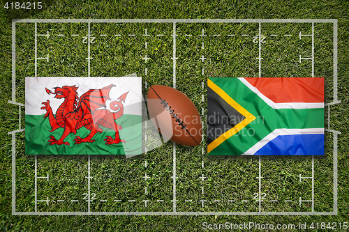 Image of Wales vs. South Africa flags on rugby field