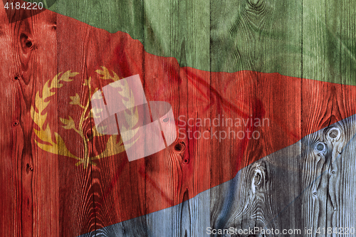 Image of National flag of Eritrea, wooden background