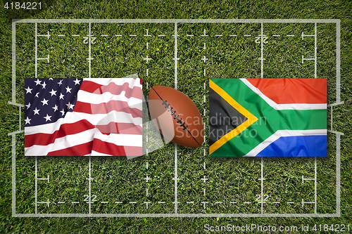 Image of USA vs. South Africa flags on rugby field