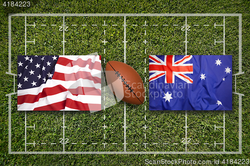 Image of USA vs. Australia flags on rugby field