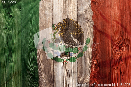 Image of National flag of Mexico, wooden background