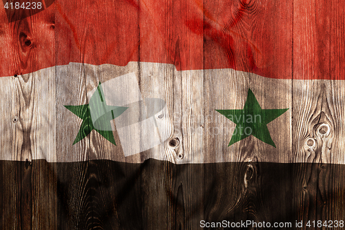 Image of National flag of Syria, wooden background