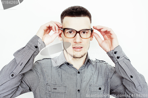 Image of young handsome well-groomed guy posing emotional on white background, lifestyle people concept