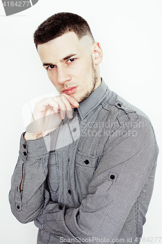 Image of young handsome well-groomed guy posing emotional on white background, lifestyle people concept 