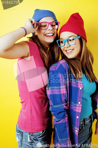 Image of lifestyle people concept: two pretty stylish modern hipster teen girl having fun together, happy smiling making selfie