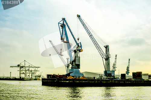 Image of silhouette of port cranes