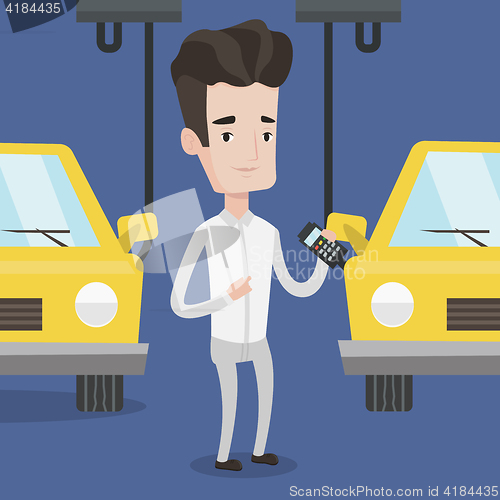 Image of Worker controlling automated assembly line for car