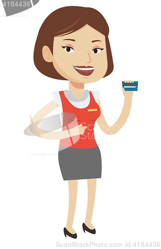 Image of Cashier holding credit card at the checkout.