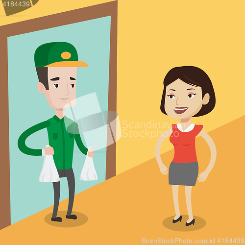 Image of Delivery man delivering groceries to customer.