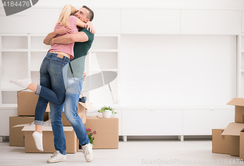 Image of happy Young couple moving in new house