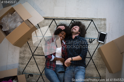 Image of Top view of attractive young multiethnic couple