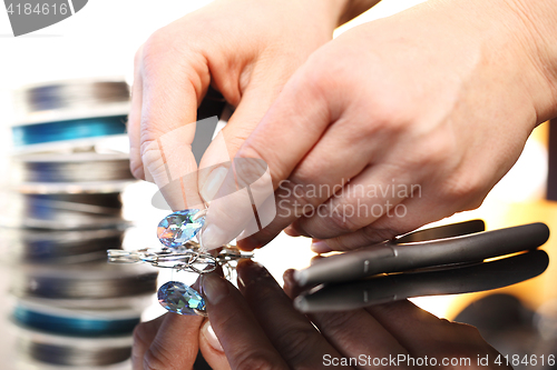 Image of Jeweler creates jewelry