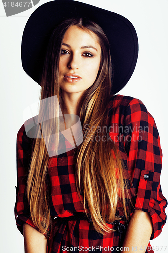 Image of young pretty brunette girl hipster in hat on white background casual close up dreaming smiling. real american modern woman, lifestyle real people concept
