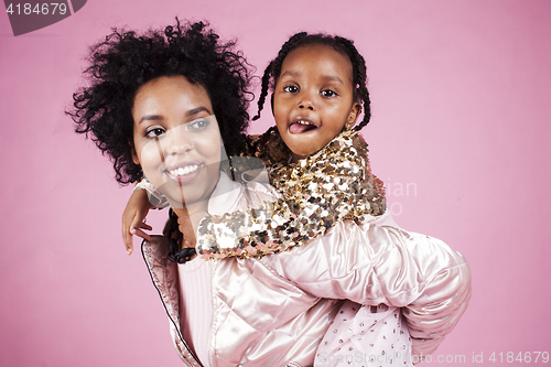 Image of young pretty african-american mother with little cute daughter h