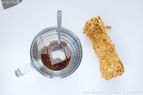 Image of Instant coffee and eclair, top view