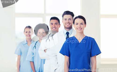 Image of group of happy doctors at hospital