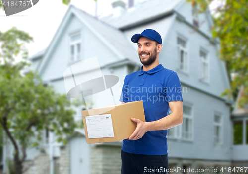 Image of happy delivery man with parcel box