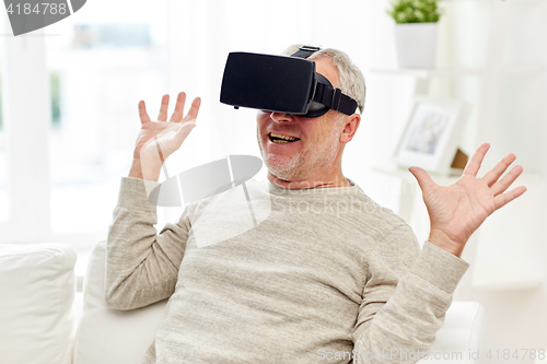 Image of old man in virtual reality headset or 3d glasses