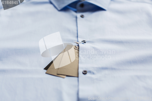 Image of close up of shirt with price tag