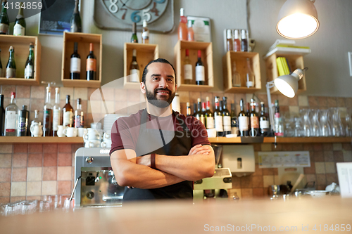 Image of happy man, barman or waiter at bar