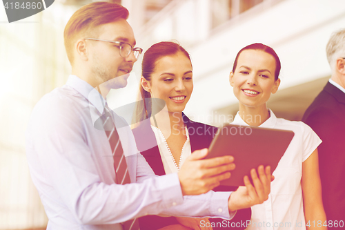 Image of business people with tablet pc computer at office