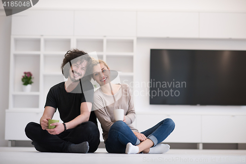 Image of young couple in their new home