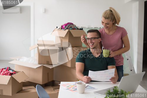 Image of Young couple moving in a new home