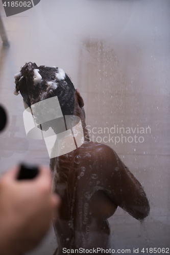 Image of African American woman in the shower
