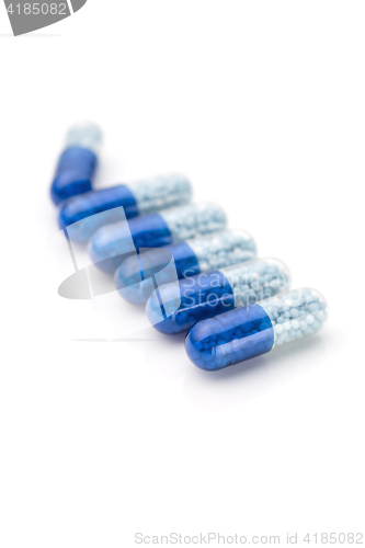 Image of Blue capsules and pills background