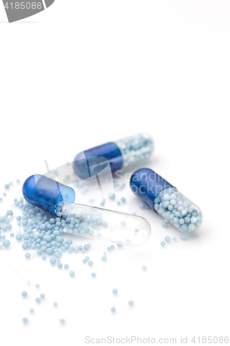 Image of Blue capsules and pills background