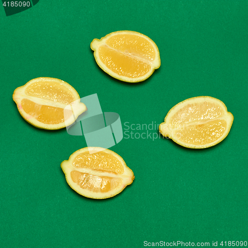 Image of Lemons on green background