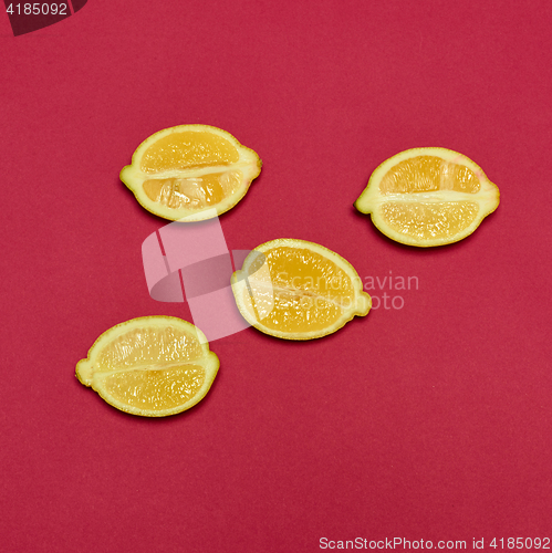 Image of Lemons on red background