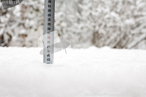 Image of tape measure in snow