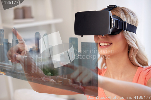 Image of woman in virtual reality headset with city