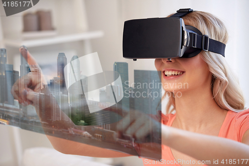 Image of woman in virtual reality headset with city