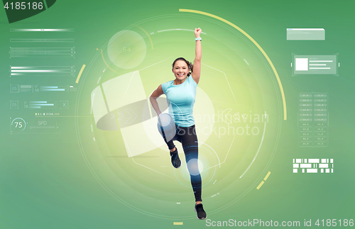 Image of happy smiling sporty young woman jumping in air