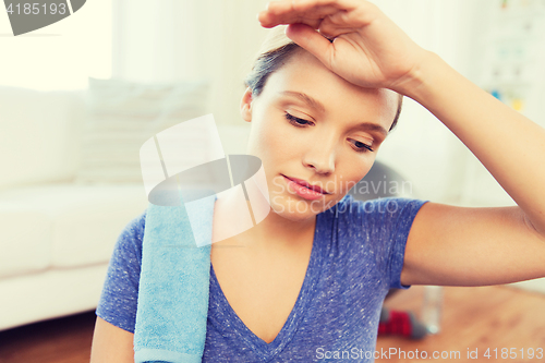 Image of close up of tired woman after workout at home