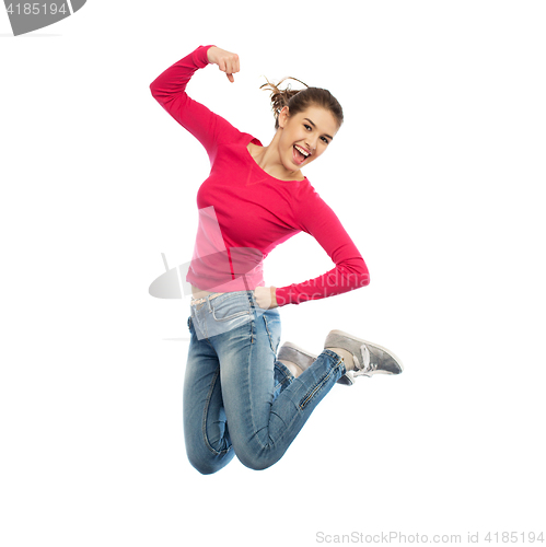 Image of smiling young woman jumping in air