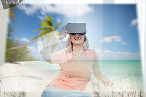 Image of woman with virtual reality headset over beach